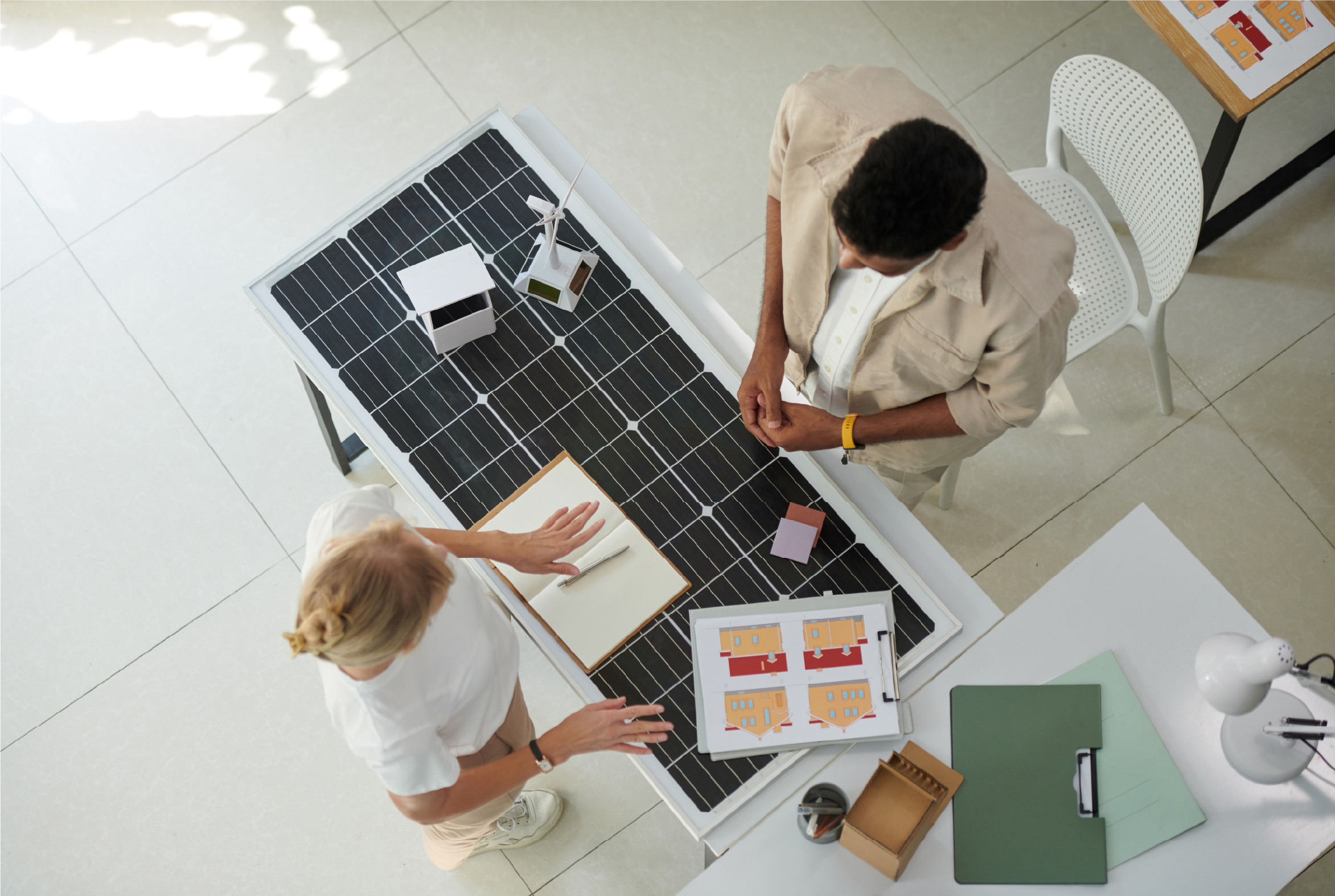 A Maritime Solar representative explaining the costs of solar panel installation to a Nova Scotia homeowner.